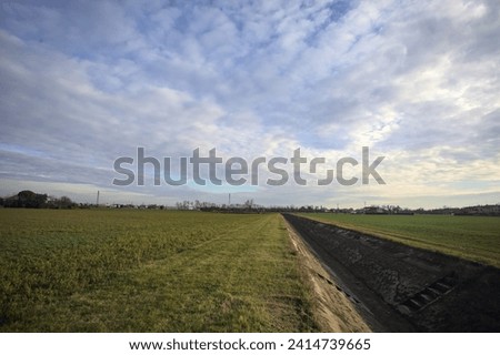 Grass fields with an irrigation channel