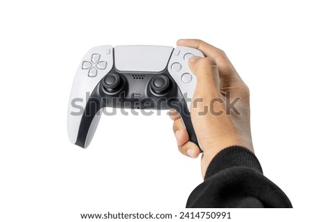 Gamer hand using video game console controller isolated over white background. Playing games concept Royalty-Free Stock Photo #2414750991