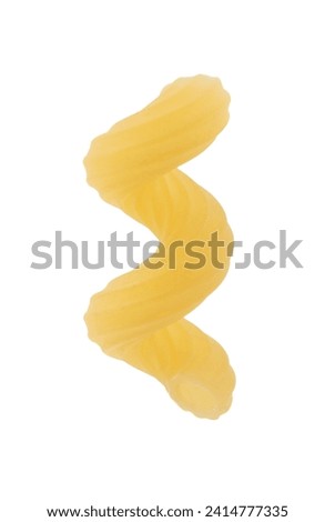 One piece of cavatappi pasta isolated on white Royalty-Free Stock Photo #2414777335