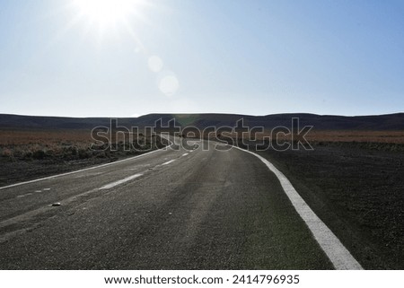 Lonely road curve desert bokeh chile South America. High quality photo Royalty-Free Stock Photo #2414796935