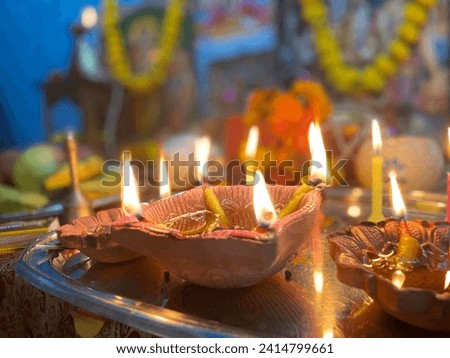 Radiance of Diwali: Illuminating joy and warmth with the flickering glow of diyas. Royalty-Free Stock Photo #2414799661