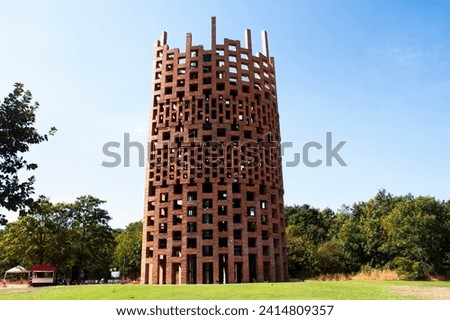 View landscape and modern building art tower of Ban Ta Klang or Taklang Elephant Village Study Centre for thai people travelers visit and learn life local Kui ethnic with elephants in Surin, Thailand Royalty-Free Stock Photo #2414809357