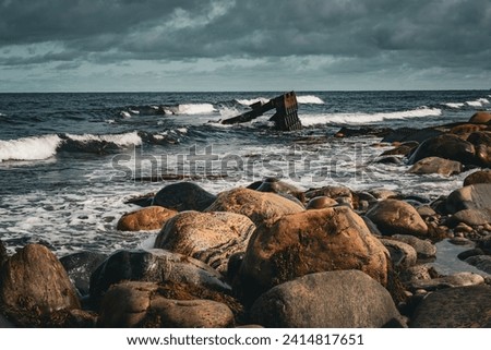 Wreck of the S.S. Ethie at Martin's Point is in Gros Morne National Park on The Viking Trail in Newfoundland, Canada. Rusty debris from 1919 shipwreck along a rocky shore. Royalty-Free Stock Photo #2414817651