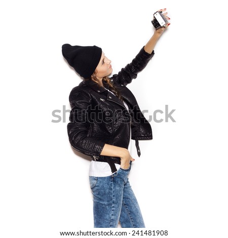 Beautiful girl taken pictures of her self . White background, not isolated