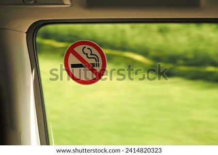 No smoke sign on car window 