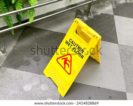 the sign of wet floor in public place 