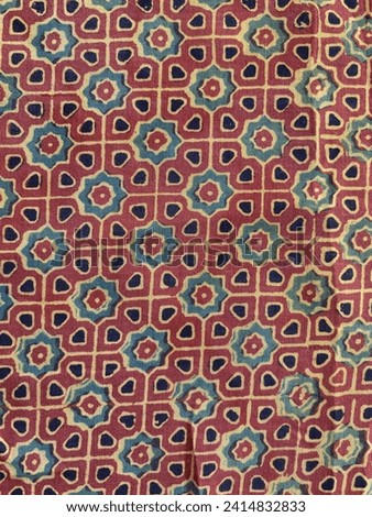 Rust, black and green intricate geometric ajrakh print silk fabric  Royalty-Free Stock Photo #2414832833