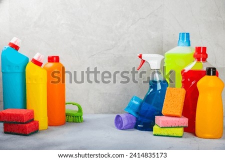 Cleaning service concept.Home cleaning product on a light background. Bucket with household chemicals. cleaning supplies for home or office space.Early spring regular cleaning. Copy space