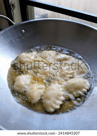 A photo of a cake being fried. Perfect for magazines, newspapers and tabloids