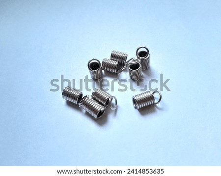 Steel spring on a white background. This photo is perfect for magazines, advertisements, posters, banners