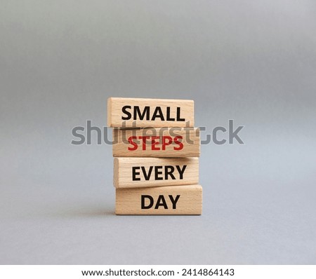 Small Steps Every Day symbol. Wooden blocks with words Small Steps Every Day. Beautiful grey background. Business and Small Steps Every Day concept. Copy space.