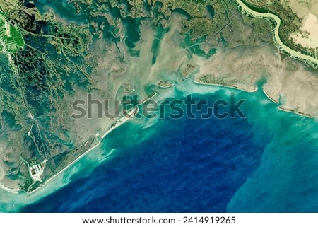 Reshaping Coastal Louisiana. While there are efforts to reinforce its beaches and marshes, some of Barataria Bay is slowly slipping away. Elements of this image furnished by NASA. Royalty-Free Stock Photo #2414919265