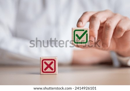 Businessman is thinking and making choices right from wrong symbols. Decide to vote accept or not. Yes or No decisions, business options in difficult situations. True False, crisis decision making. Royalty-Free Stock Photo #2414926101