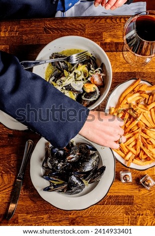 Mussels, steamed and prepared in traditional Italian preparation—in a white wine sauce, garlic, lemon juice, shallots, butter and topped with chopped Italian parsley. Seasoned with salt and pepper. 