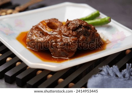 where each bite is a harmonious blend of succulence and spices, inviting a culinary crescendo of indulgence Royalty-Free Stock Photo #2414953445