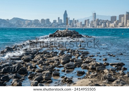 View of the Benidorm skyline with high-rise buildings and mountains on the Mediterranean Coast in Alicante, Spain