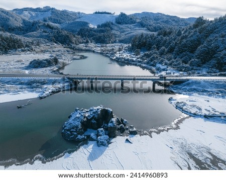 beautiful tranquil scene in gold beach with hunter creek and snow, a rare weather event that happened February 24, 2023. Royalty-Free Stock Photo #2414960893