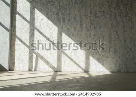 Drawing a shadow from a window on a concrete wall and floor