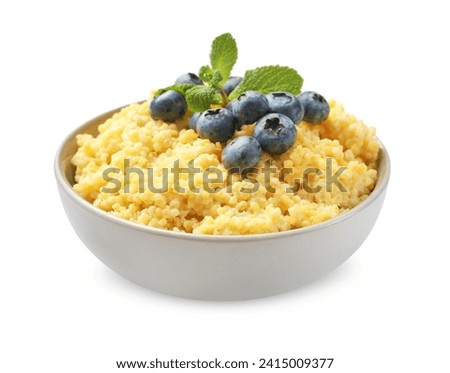 Tasty millet porridge with blueberries and mint in bowl isolated on white Royalty-Free Stock Photo #2415009377