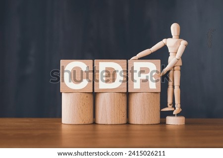 There is wood cube with the word CDR. It is an abbreviation for Carbon Dioxide Removal as eye-catching image. Royalty-Free Stock Photo #2415026211