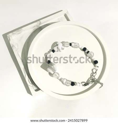 Black and white beaded bracelet. Trendy fashionable accessories design. Isolated in white background. This photo is perfect visual for online shop catalogue, reference idea, or business advertise