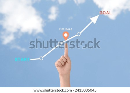 Child's hand and arrow flow with start and goal word Royalty-Free Stock Photo #2415035045