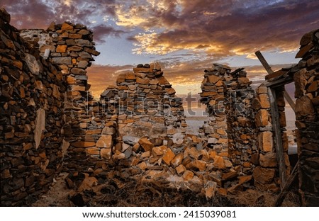 Ancient Building in Rural Landscape with stormy evening Clouds in South Australia, situated in the Flinders Ranges. Sunset view