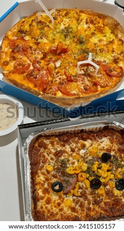 pizza and spaghetti delivered, a picture of delicious food