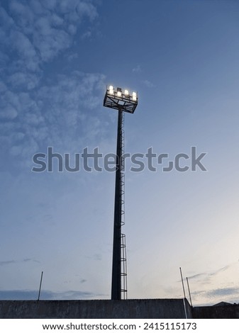 stadium lights and clear sky in the morning
