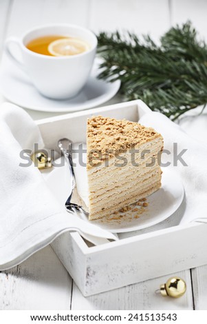 Honey cake (medovik) on white plate
