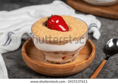 Strawberry magnolia dessert. Magnolia dessert in bowl on dark background. Close up