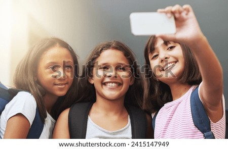 Friends, children and smile for selfie in elementary school, educational memory and learning together. Diversity, young students and group of girls taking picture for social media, photography or fun