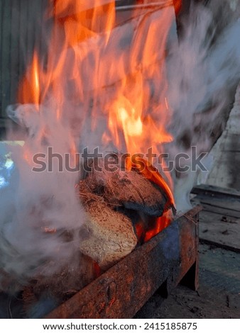 Burn coconut shells with very large fire