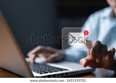 Email marketing concept, person reading e-mail on laptop computer, receive new message. New email notification concept for business e-mail communication and digital marketing. newsletter online. Royalty-Free Stock Photo #2415193701