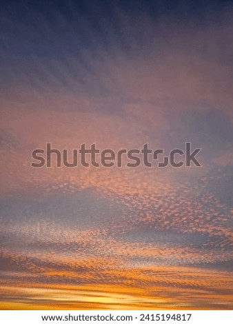 Wonderful winter sunset background. Colorful sundown clouds texture