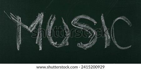 Hand draw chalk, word music on green chalkboard, blackboard texture 