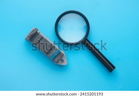 A picture of vessel miniature and magnifying glass. Search booking shipment
