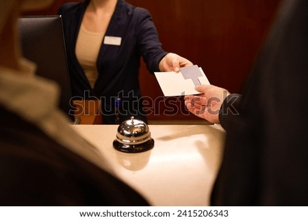 Cropped picture of female hand giving keycard to man hand