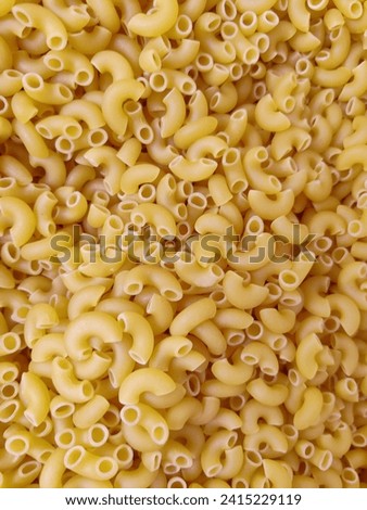 A picture of dry macaroni ready for cooking 