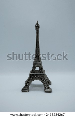 Eiffel Tower figurine isolated on white background. The first attraction and symbol of Paris is the Eiffel Tower. Set for design