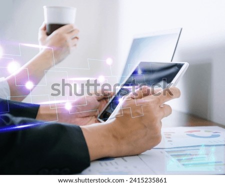 Young office worker sitting and working using a tablet Technology