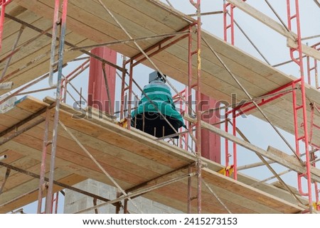 Catholic Church construction of new bell tower and parish center  Royalty-Free Stock Photo #2415273153