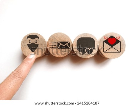 Wooden cube blocks with scammer,buble chat and envelope symbols. Love scam and trap concept. Royalty-Free Stock Photo #2415284187