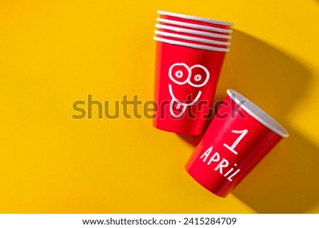 April Fools' Day celebrated on April 1 concept, background with Paper cup for prank.