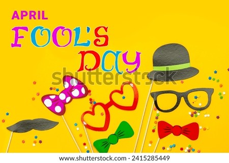 April Fools' Day celebrated on April 1 concept, background with decorative lettering, Handheld masquerade Mask in paper cut style, Stick mask.