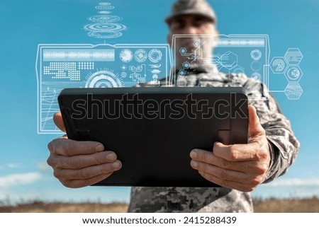 AI technology in the army. Warfare analytic operator checking coordination of the military team. Military commander with a digital tablet device with artificial intelligence operating troops outdoors. Royalty-Free Stock Photo #2415288439