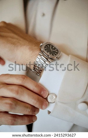Groom wedding set with shoes wristwatch bow tie, close-up stock photo
