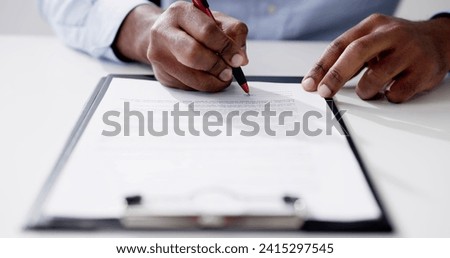 Agreement Form Signature. Hand Signing Paper Using Pen