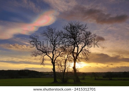 Cloudscape with rare Nacreous clouds at sunset near Ferryhill, County Durham England, UK. Royalty-Free Stock Photo #2415312701