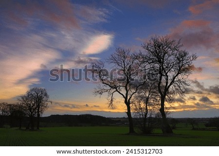 Cloudscape with rare Nacreous clouds at sunset near Ferryhill, County Durham England, UK. Royalty-Free Stock Photo #2415312703